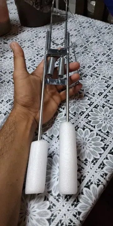 An angler holding a fishing rod with a proper grip